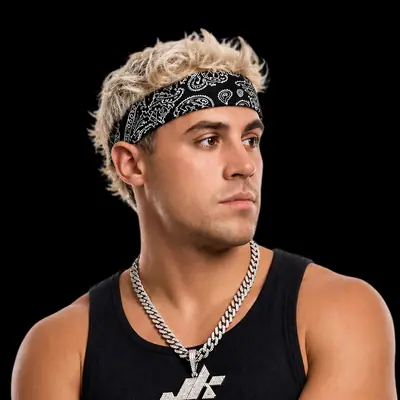 Studio portrait of JK with arms crossed